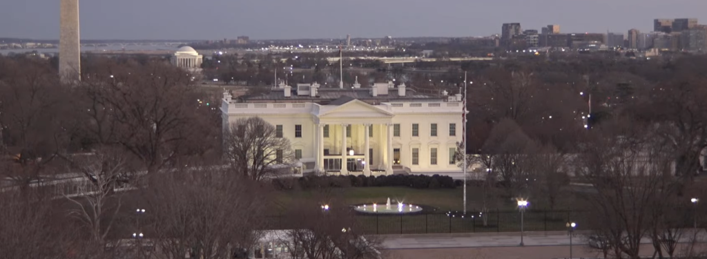 A view of the front of the White House at dusk